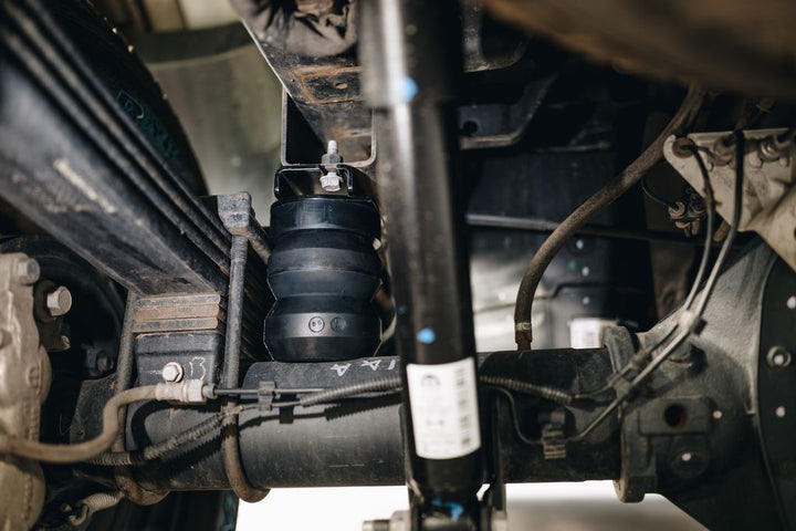 Why Timbren SES Offers Smoother Ride Quality Under Load Than Coil-Spring Lift Systems